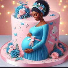 a pregnant woman standing next to a pink cake with blue flowers and butterflies on it