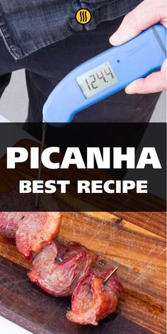 a person cutting meat on a wooden board with a thermometer in front of them