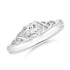 a white gold ring with a princess cut diamond in the center and an intricate design on the band