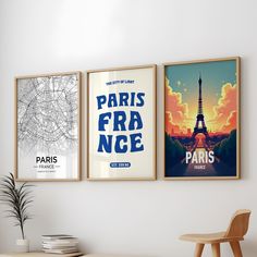 three posters hanging on the wall above a table