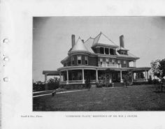 an old black and white photo of a large house