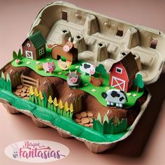 an egg carton is decorated with farm animals and farm scenes on the inside of it