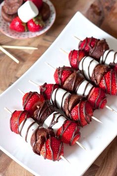 chocolate covered strawberries on skewers with toothpicks