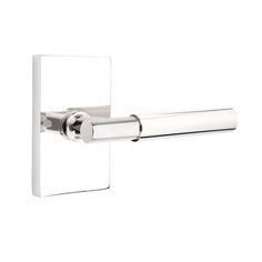 an image of a chrome finish toilet roll holder with square cover and metal rollers