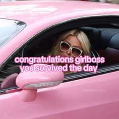 a woman wearing sunglasses sitting in a pink car with the caption congratulations girlboss you survived the day