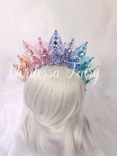 This pastel rainbow tiara crown halo has metal lace filigree mounted to a headband with sparkly pastel rainbow colour glass and High end Austrian crystal rhinestones. An elegant and beautiful piece that is excellent for so many occasions from dance costumes to dressing up as a queen, fairy, photo shoots and special occasions. This beautiful crown is elegant and fun.  A super sparkly halo of bright rainbow coloured filigree to adorn the top of the head, dripping with Swarovskis, glass rhinestones Queen Headpiece, Rainbow Wedding Theme, Queen Fairy, Rainbow Crown, Queen Tiara, Crown Halo, Queens Tiaras, Rainbow Fairies, Fairy Crown