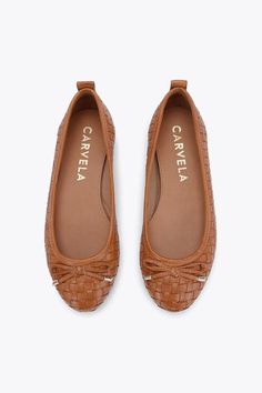 The Carvela Evie is a slip on ballet flat crafted from a tan leather with weave effect. There is a bow on the toe with gold tone eyelets. There is a gold tone Icon C at the back of the ankle. Brown Weave, Leather Ballet Shoes, Only Shoes, Womens Fragrances, Cleanser And Toner, Ballet Flat, Mens Fragrance, Formal Shoes, Leather Flats