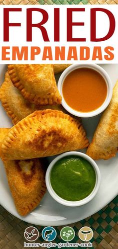 fried empanadas on a plate with dipping sauce