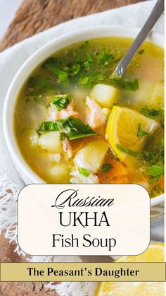 a bowl of fish soup with lemons and parsley