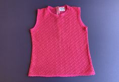 Vintage 1970's Sweater ~ Hot Pink, Sleeveless, Zips Up The Back, And Very Soft ~ Made In Japan ~ Great Quality And Condition ~ Size Small I will be mailing this Priority Mail and First Class International. Measurements Bust 34 Inch Waist 30 Inch Length 19 Inch Retro Fitted Sleeveless Tank Top, Fitted Retro Sleeveless Tank Top, Retro Sleeveless Vest Top, Fitted Sleeveless Pink Sweater Vest, Vintage Fitted Tank Vest, Retro Fitted Sleeveless Tops, Retro Stretch Tank Top, Fitted Sleeveless Retro Tops, Retro Fitted Sleeveless Vest