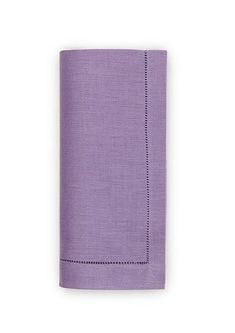 a purple linen napkin with stitching on the edges and a black line in the middle