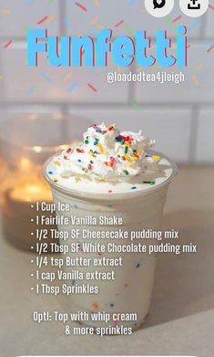 a cup filled with whipped cream and sprinkles