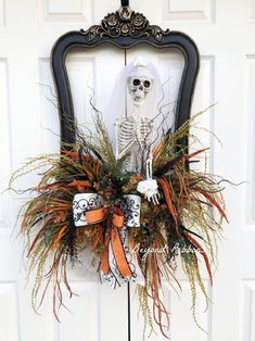 a skeleton wreath is hanging on the front door