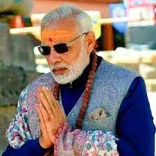 an old man with white hair wearing sunglasses and holding his hands together in front of him