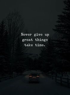 a car is driving down the road at night with a quote on it that says never give up great things take time