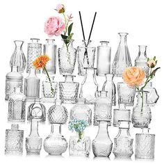 a large collection of vases and flowers are arranged on a white background with one flower in the middle