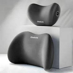 two black speakers sitting on top of each other in front of a white box with the word choboe written on it