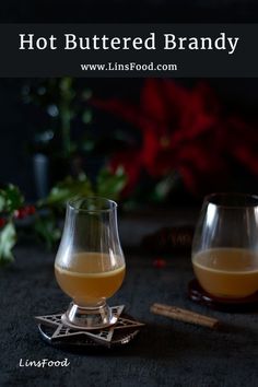 hot buttered brandy in two glasses with cinnamon sticks