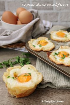 some food that is sitting on a table next to a bowl with eggs in it