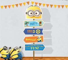 a despicable minion standing in front of a party sign