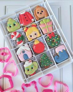 some decorated cookies in a box on a table