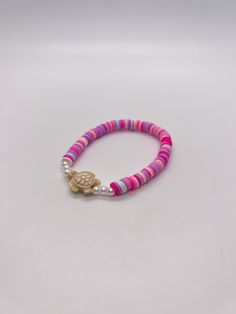 Handmade 7 in. preppy beaded bracelet. Contains light pink, hot pink, white, and purple 6mm clay beads. Also has pearl beads, and a cute turtle bead!! I can custom create any jewelry for you. Just let me know what colors you want, and if you want a word on it or not. I can also make phone charms and rings, and necklaces. Adjustable Pink Pearl Bracelet With Spacer Beads, Pink Heishi Beads Friendship Bracelets For Vacation, Hypoallergenic Pink Friendship Bracelets For Beach, Pink 8mm Beads Jewelry For Beach, Pink Friendship Bracelets With 8mm Round Beads, Pink Hypoallergenic Beaded Bracelets For Beach, Hypoallergenic Pink Beaded Bracelets For Beach, Pink Hypoallergenic Bracelets For The Beach, Hypoallergenic Pink Bracelets For The Beach