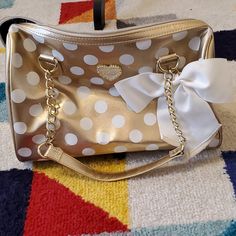 Stunning Gold And White Polka Dot Betsey Johnson Shoulder Bag With Adorable White Bow Accent. Great Size For Storage. Zipper Enclosure. Numerous Pockets Inside. Never Used. Excellent Condition! Great Gift Idea! Offers Welcome! Cute Gold Bags For Everyday Use, Cheetah Bag, Betsey Johnson Purses Handbags, Betsy Johnson Bags, Betsy Johnson Purses, Betsey Johnson Novelty Bags, Skull Purse, Betsey Johnson Skull Bag, Betsey Johnson Purses