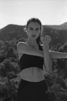 black and white photograph of woman in sports bra