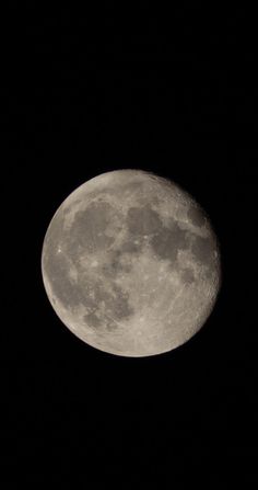 the full moon is seen in the dark sky