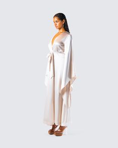 She’s boujee or whateva 👑 Made from satin fabric and complete with a tie belt and oversized bell sleeves, this robe will make you feel like a million bucks - even when you’re just lounging around 👏 Chic Satin Robe For Wedding Night, Spring Party Satin Kimono, Chic Summer Evening Robe, Spring Party Satin Robe, Chic Satin Wrap Kimono, Chic Long Sleeve Satin Kimono, Chic Satin Evening Robe, Silk Loungewear Dress With Kimono Sleeves, Chic Robe For Spring Parties