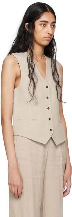 Stretch linen- and viscose-blend canvas vest. · V-neck · Button closure · Welt pockets · Partial satin lining Supplier color: Sand Beige Sleeveless Single-breasted Vest, Beige Single-breasted Sleeveless Vest, Beige Single Breasted Sleeveless Vest, Beige Workwear Vest With Button Closure, Beige Button Closure Vest For Work, Linen Workwear Vest With Buttons, Linen Vest With Buttons For Work, Chic Linen Vest With Buttons, Beige V-neck Vest With Pockets