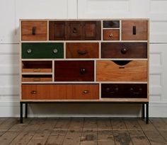 a multicolored chest of drawers with metal handles