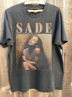 Vintage Sade tshirt, Sade retro vintage shirt, Sade t shirt, Fans Gifts, Sade Adu tshirt Gift for men, women Shirt : 100% Cotton (fiber content may vary for different colors) .: Medium fabric (5.3 oz/yd² (180 g/m .: Classic fit .: Runs true to size HOW TO ORDER Pick you favorite design. Review the size & color charts above FIRST and then select shirt size and color from the dropdown menu. Indicate the birthday year in the personalization box. Please note size measurements for t-shirts may differ Sade Tshirt Outfit, Sade T Shirt, Sade Tshirt, Sade Shirt, Graphic T Shirt Outfit, Sade Adu, Smart Casual Women, Cool Graphic Tees, Cute Comfy Outfits