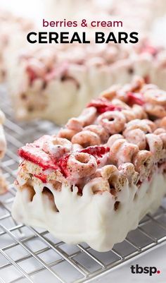 berries and cream cereal bars are on a cooling rack with the words, berries & cream cereal bars