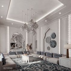 a large living room with white walls and blue rugs on the floor, chandeliers hanging from the ceiling