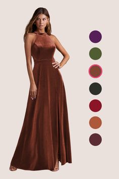 a woman in a long brown dress standing next to an assortment of color swatches