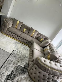 a large sectional couch sitting on top of a rug