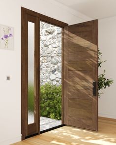 an open door leading to a stone wall and wooden floor with plants in the background