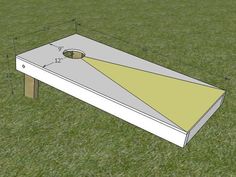 a drawing of a cornhole on the ground with an opening in the center and two holes at the top