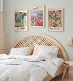 an empty bed with white sheets and pillows in a light blue bedroom - stock photo