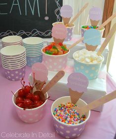 ice cream cones, strawberries, and candy are on display at a birthday party