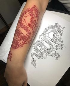 two tattoos with red ink on their arms and legs, one has a dragon in the middle