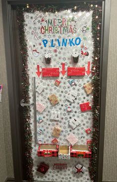 a door decorated with christmas decorations and presents