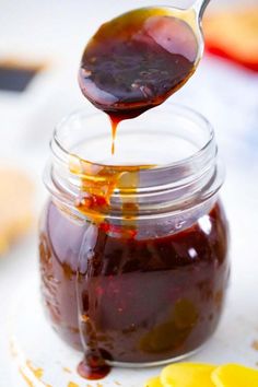 a spoon full of jam on top of a plate