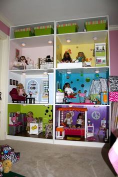 there is a doll house in the room with many dolls on it's shelves