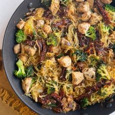 broccoli and chicken stir fry in a skillet