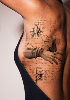 a woman's back with tattoos on her body and writing all over it,