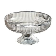 a clear glass cake dish on a white background