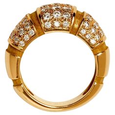 This Mauboussin bombé-form ring is an elegantly simple design that stands on its own or is easily stackable. The yellow gold ribbed dome is divided into three sections set with fine white round brilliant cut diamonds. Size 6 63 round brilliant cut diamonds, approximately 1.60cts 18K yellow gold Signed Mauboussin Paris Circa 1990s Gold Sign, Pave Diamond Ring, Denim Skirt Women, Pave Ring, Skirt Women, Round Brilliant Cut Diamond, Pave Diamonds, Round Brilliant, Simple Design