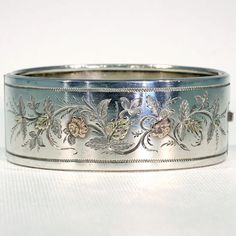 I just adore antique bangles. The abundance of silver in the late 1800s perfectly aligned with the fashion trends (thanks once again to the Queen) and aesthetics of the time, filled with delicacy and naturalism. The smooth wide illuminated surface of a silver bangle was like a blank canvas for the jewelry maker, just waiting to tell a story, honor a loved one, celebrate beauty and radiate charm. Every bangle is unique, and shines bright in the right light. This antique silver bangle was handcraf Antique Bangles, Fossil Bracelet, Sterling Ruby, Memorial Ring, Right Light, Silver Bangle Bracelet, Electroformed Jewelry, Silver Bangle Bracelets, Silver Bangle